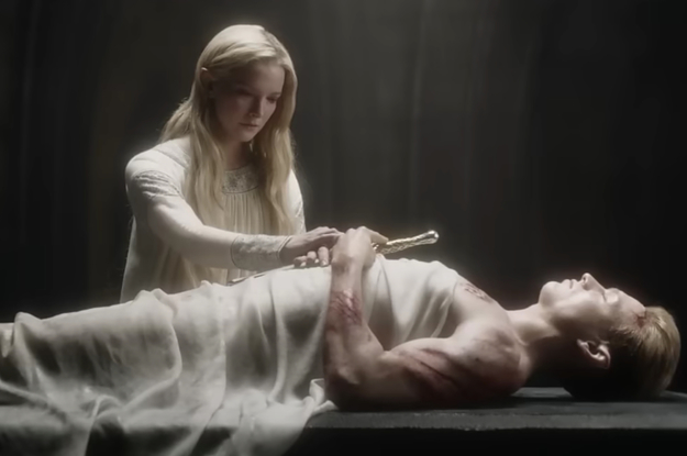 A woman stands over the corpse of a man clutching a sword