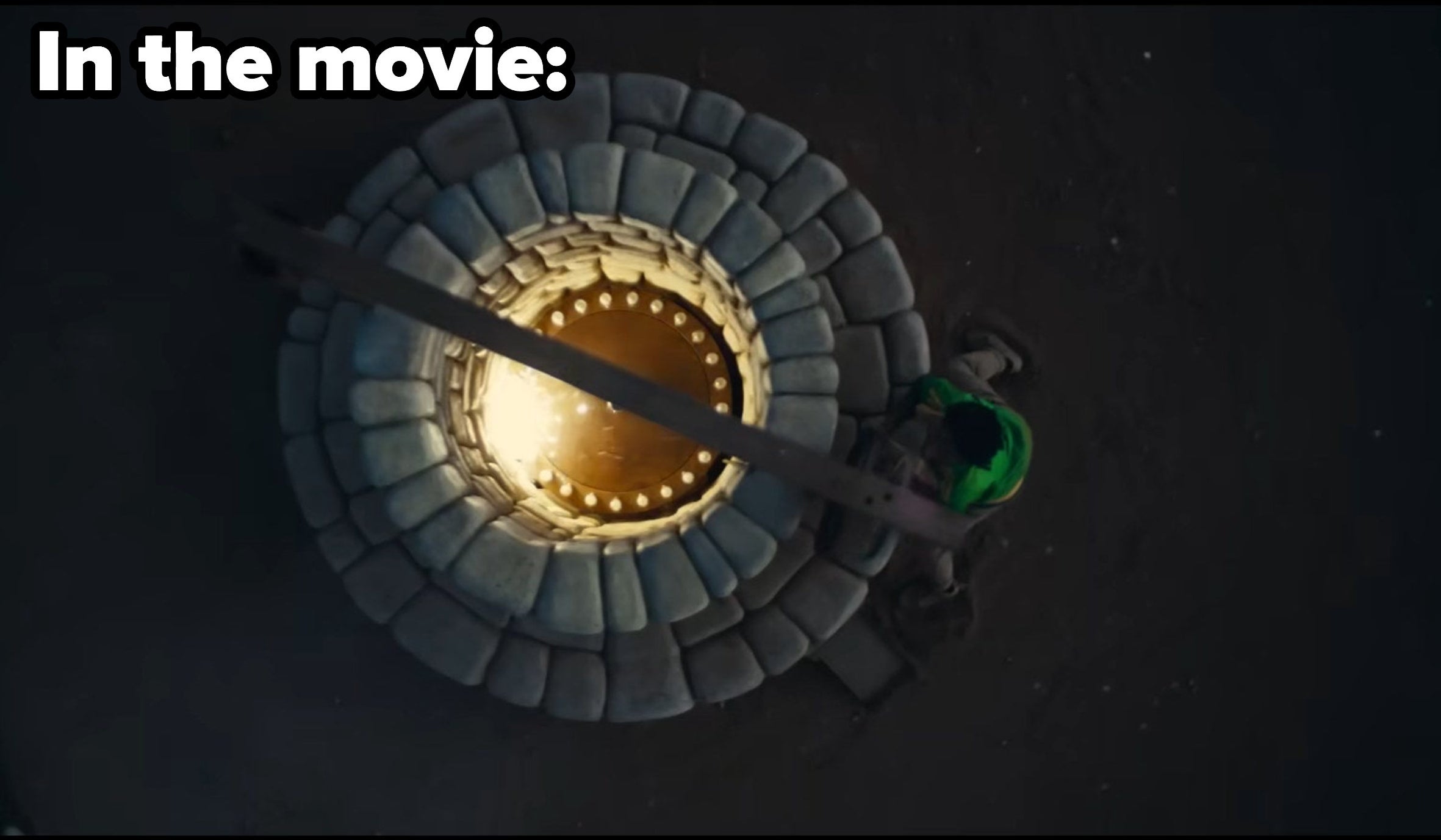 In the movie, a stone well holds a metal circle that emits a bright glow