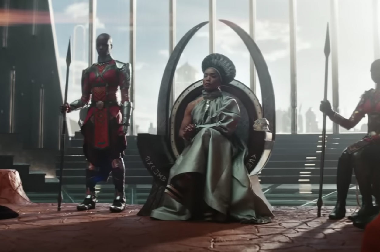 Angela Bassett sits on a throne in character as Ramonda from "Black Panther"