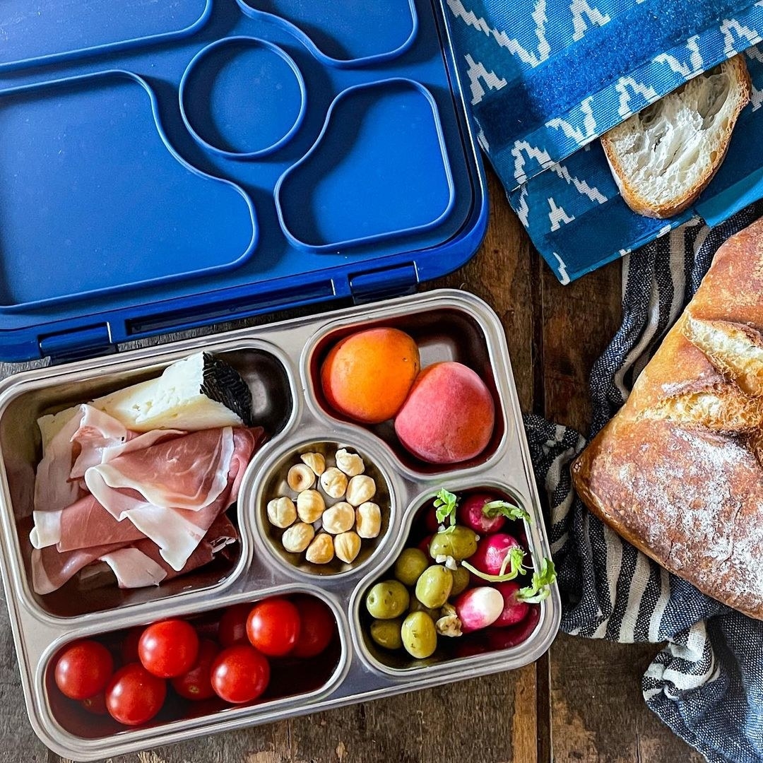The snack box filled with picnic essentials.