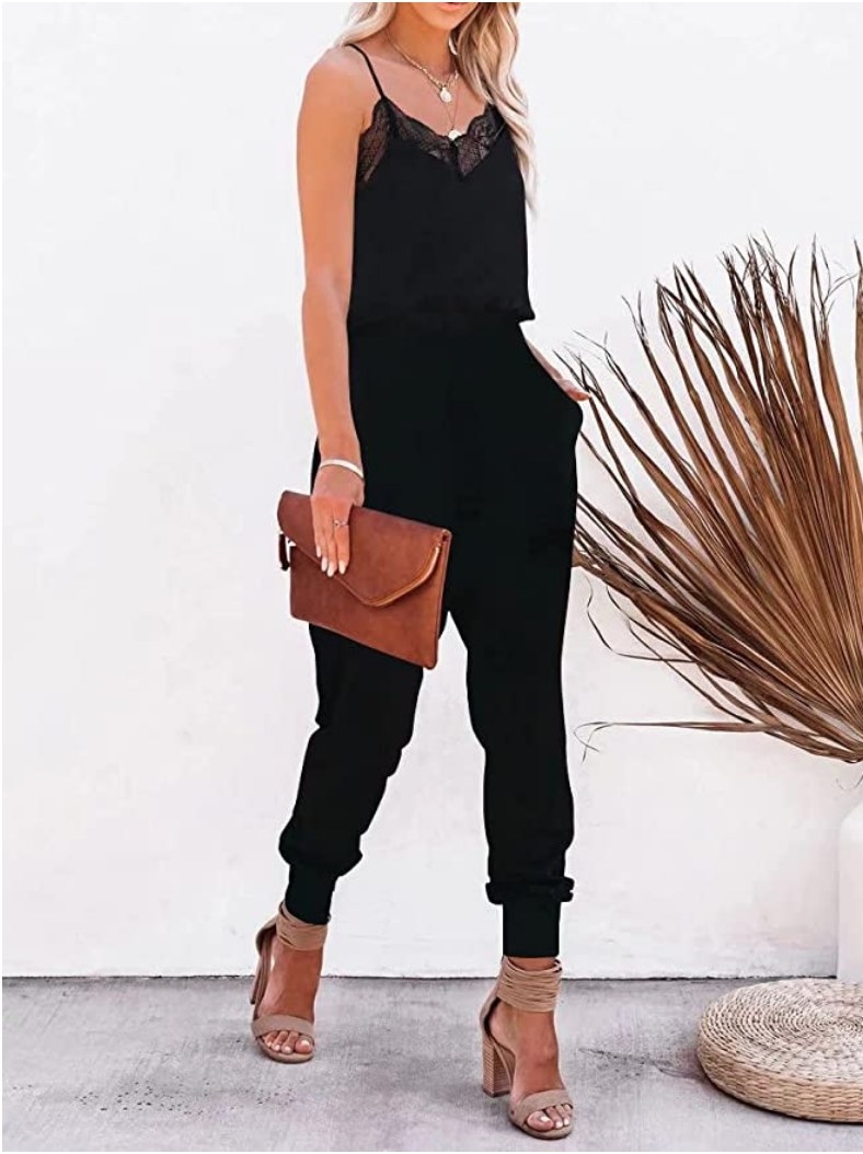 A model wearing a black lace spaghetti strap jumpsuit