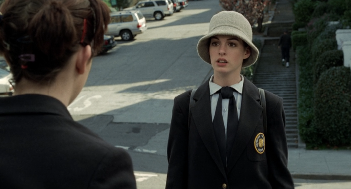 mia in her school uniform and wool bucket hat