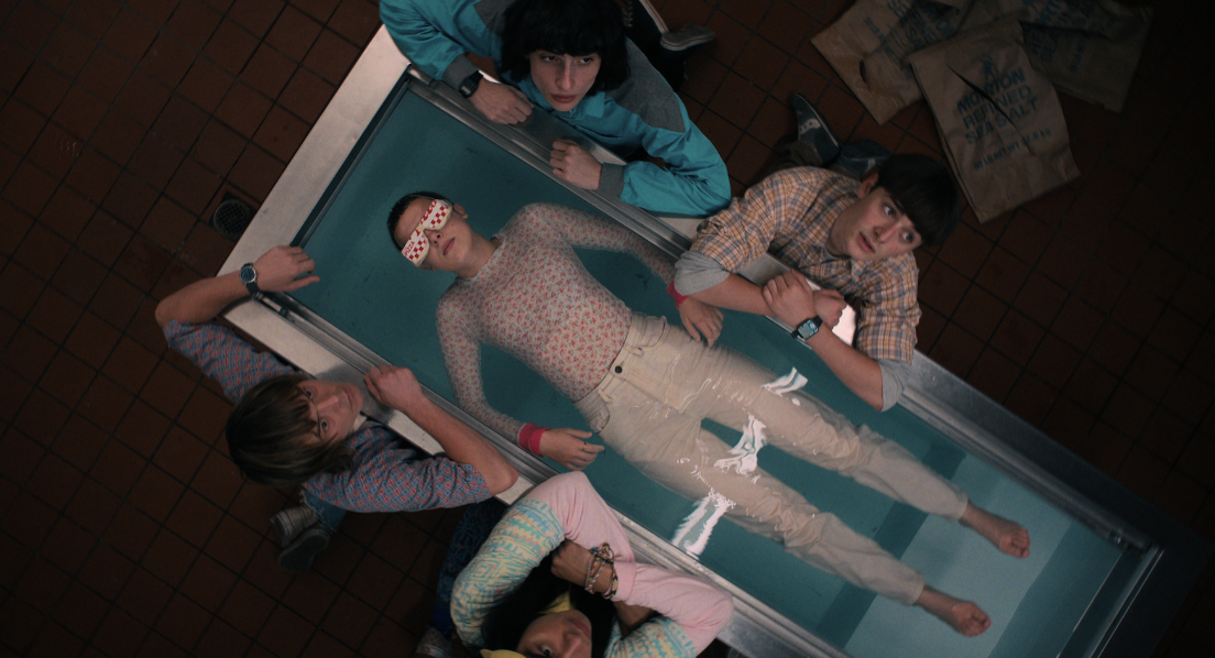 An episode still of Eleven laying in a bathtub