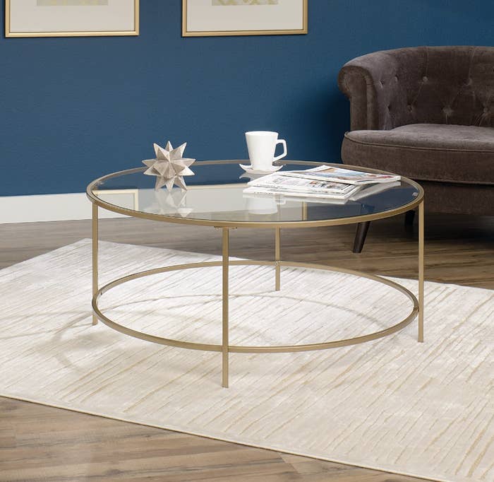 round glass coffee table on rug