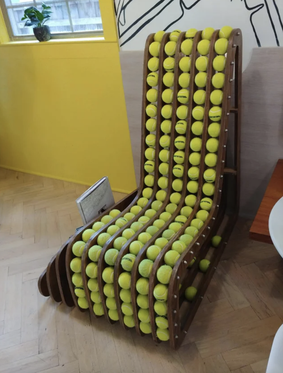 a chair with tennis balls inside it