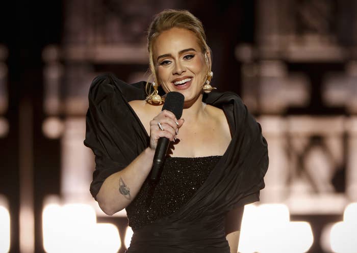 A closeup of Adele singing