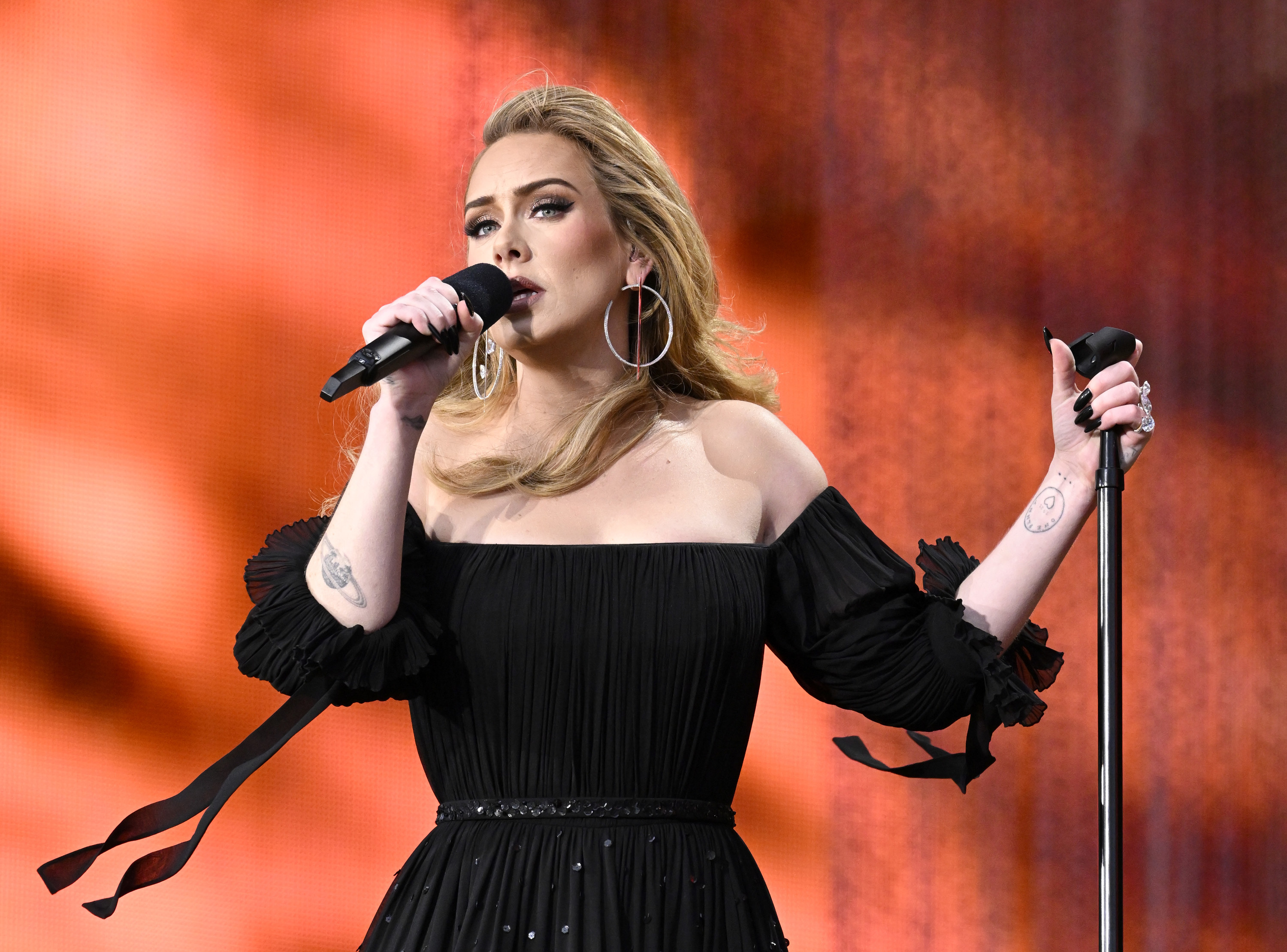 A closeup of Adele performing