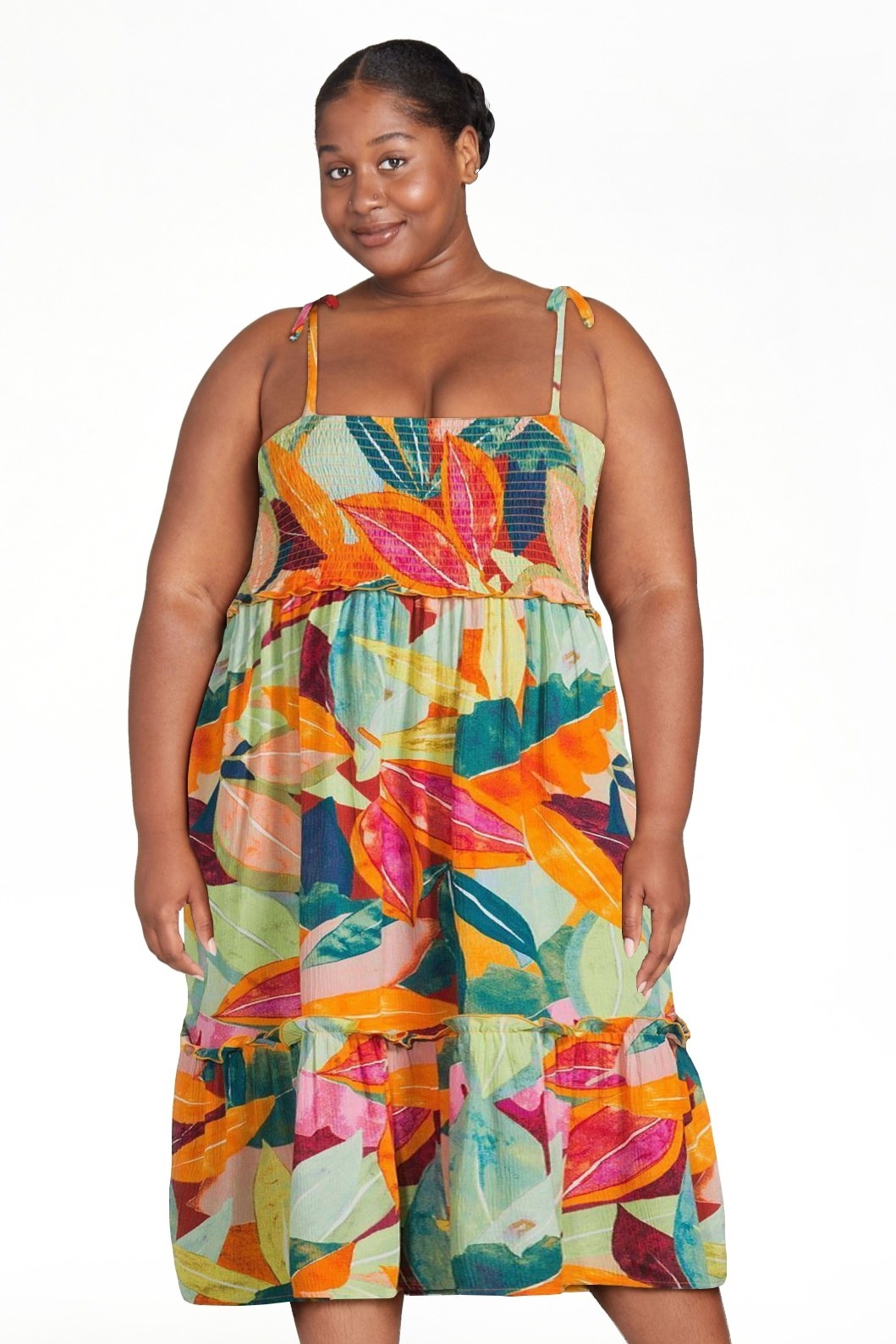 model wearing a tropical-print dress with ties on the shoulder straps