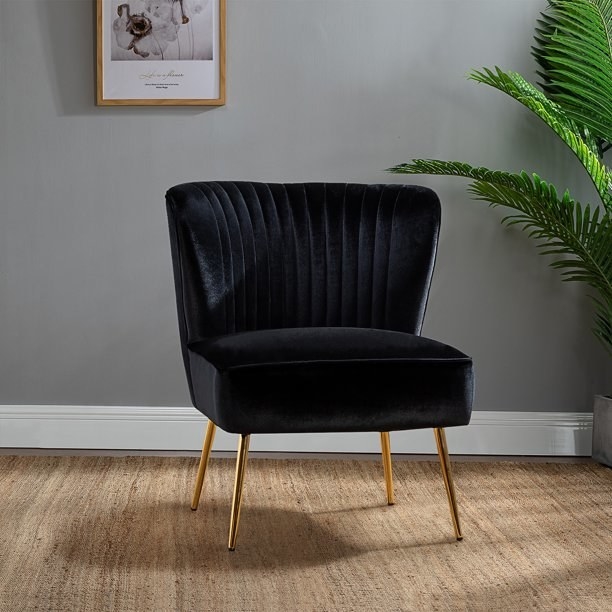 The black tufted wingback accent chair