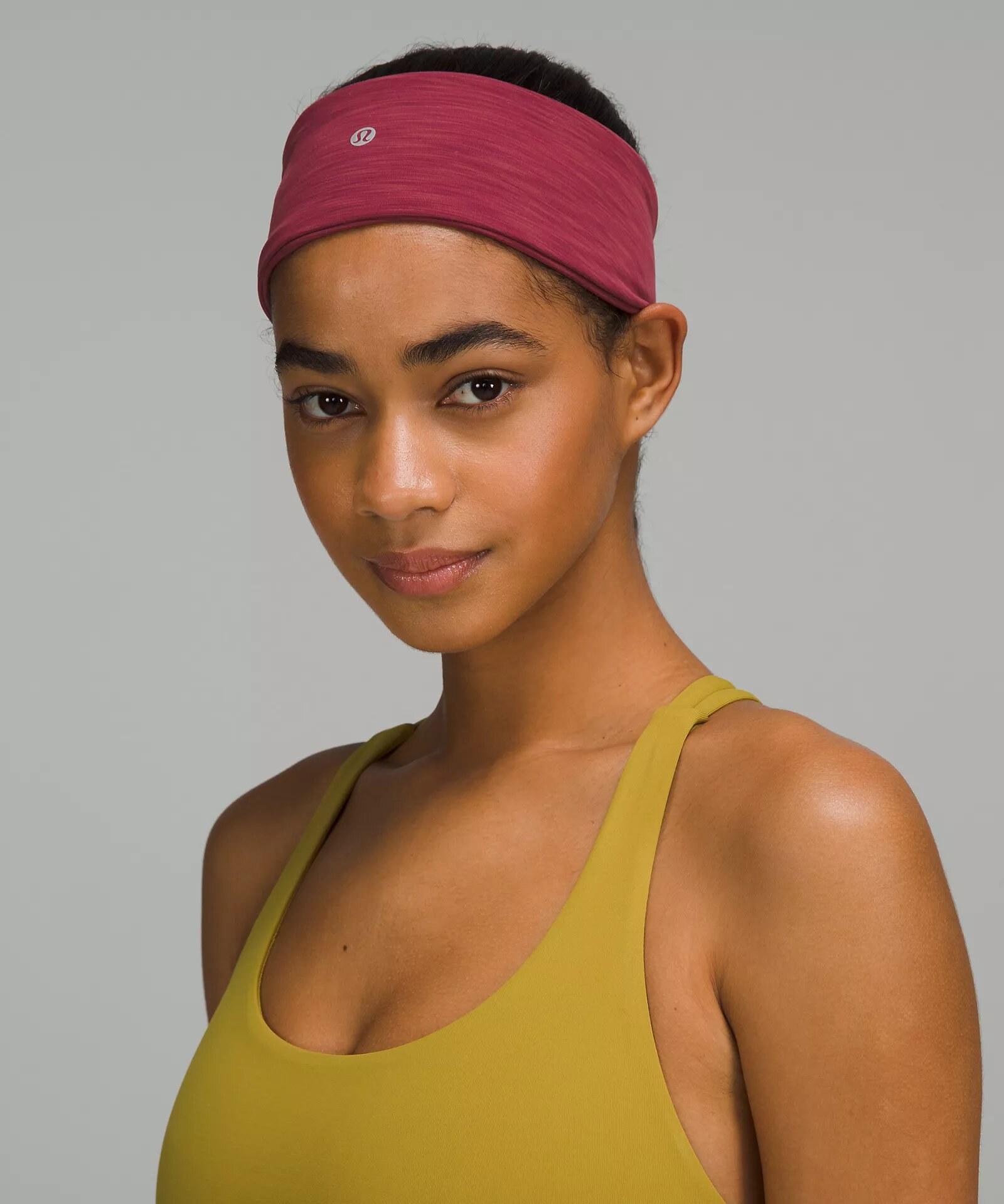 A person wearing the headband and a sports bra