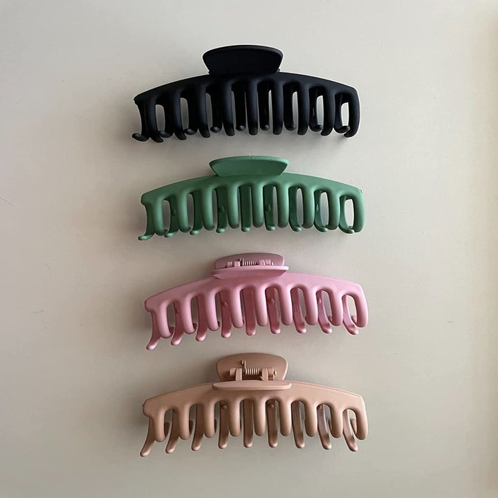 The four claws in black, green, pink and tan
