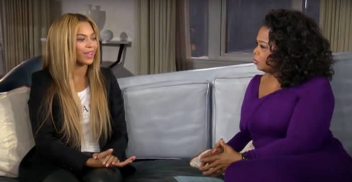 Beyoncé talking to Oprah on a couch