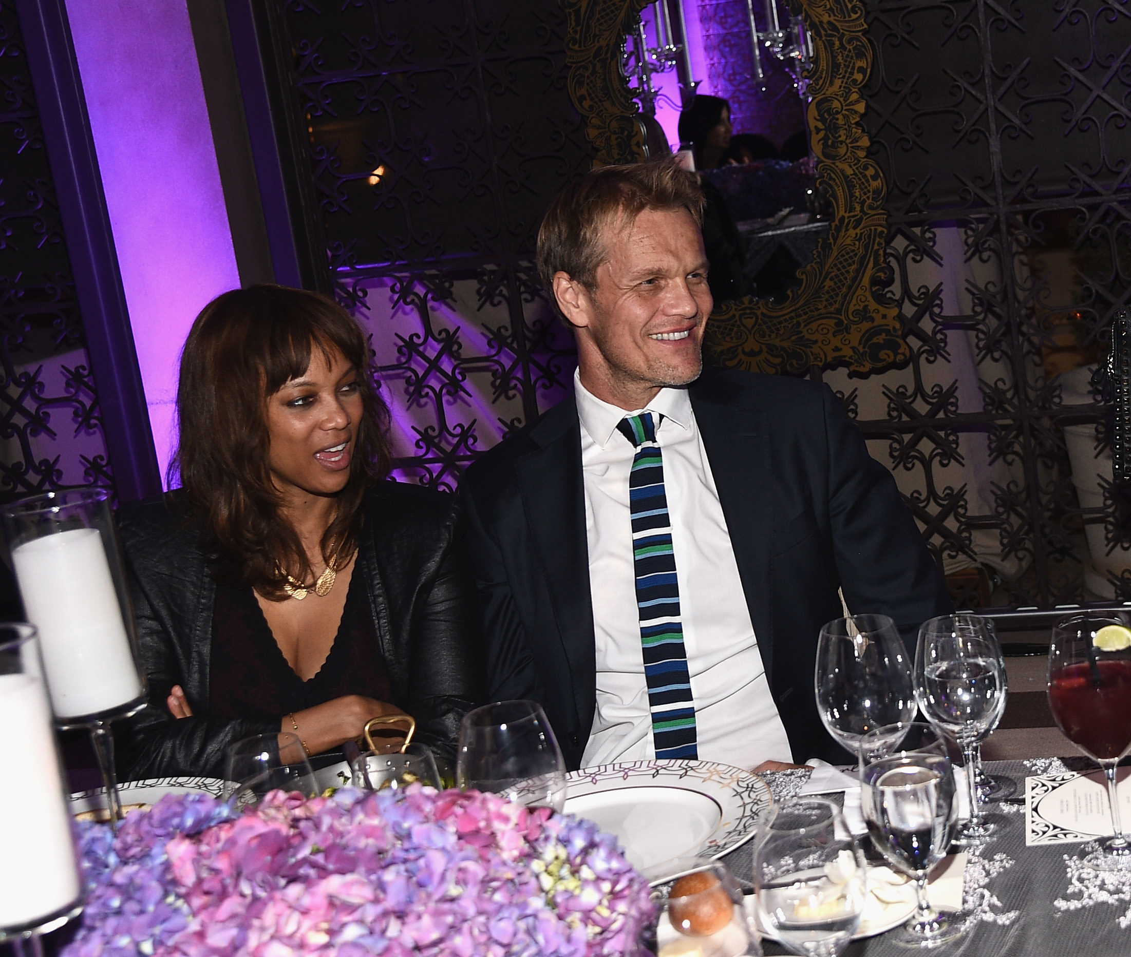 Tyra Banks and Erik Asla sit at their table during the August Getty Atelier Dinner on November 19, 2014