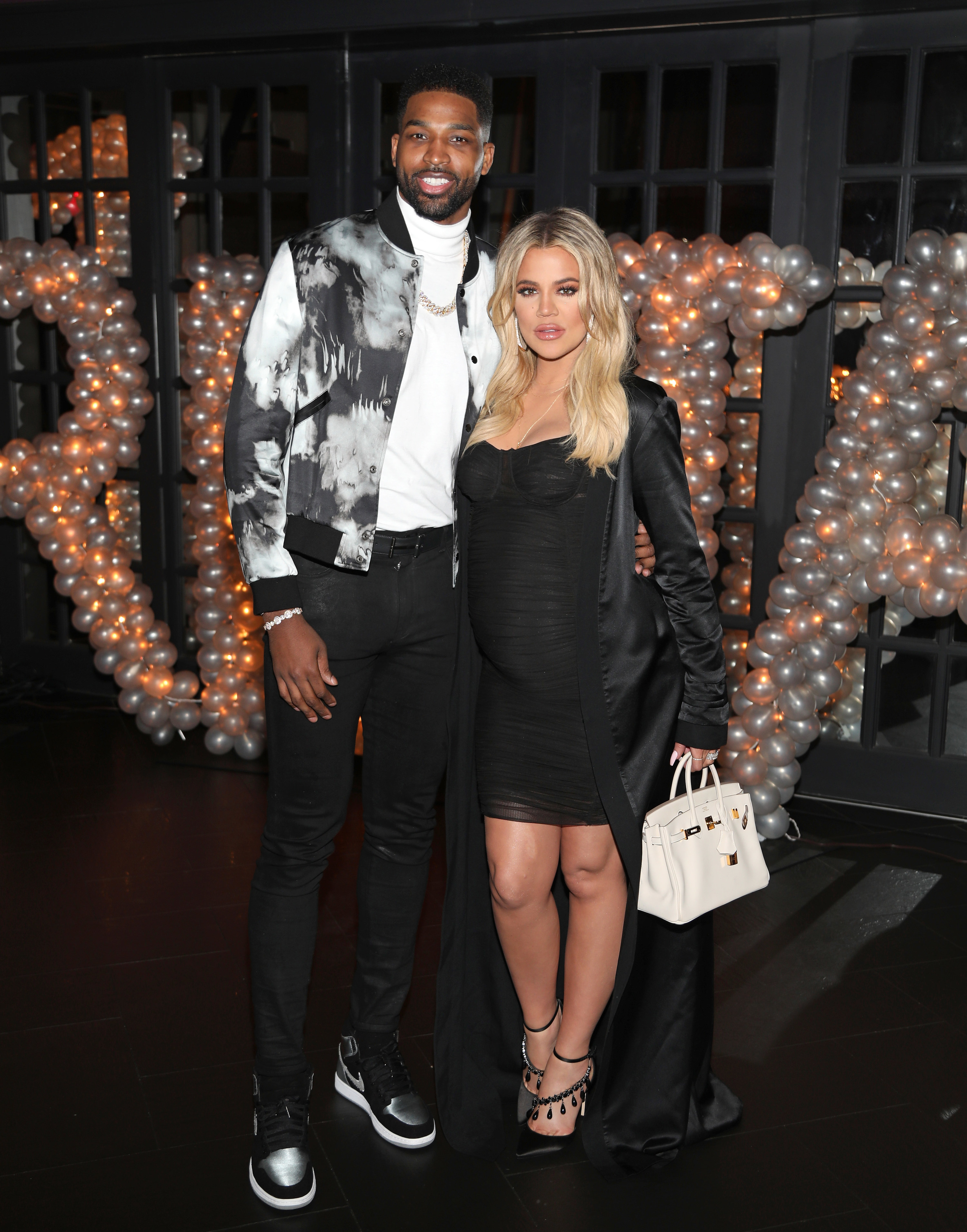 Tristan Thompson and Khloe Kardashian pose at Tristan Thompson&#x27;s Birthday at Beauty &amp;amp; Essex in March 2018