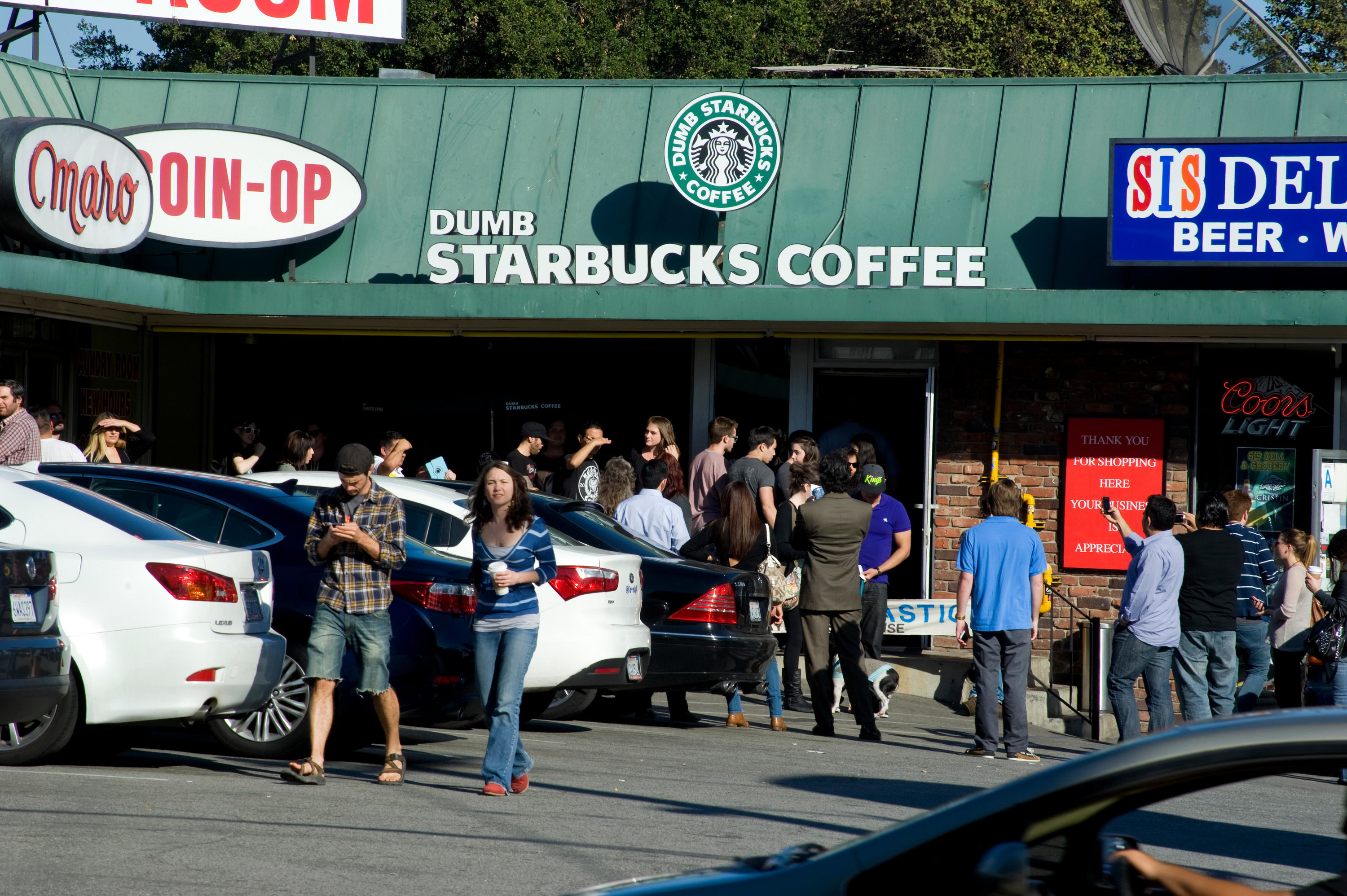 Dumb Starbucks in Los Angeles, California draws a crowd out for free coffee.