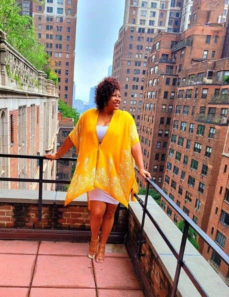Amazon reviewer wearing yellow cardigan