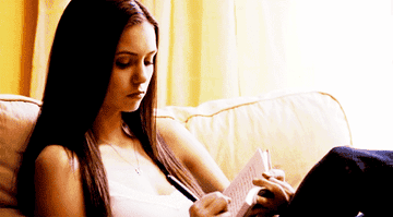 Elena writing in her diary