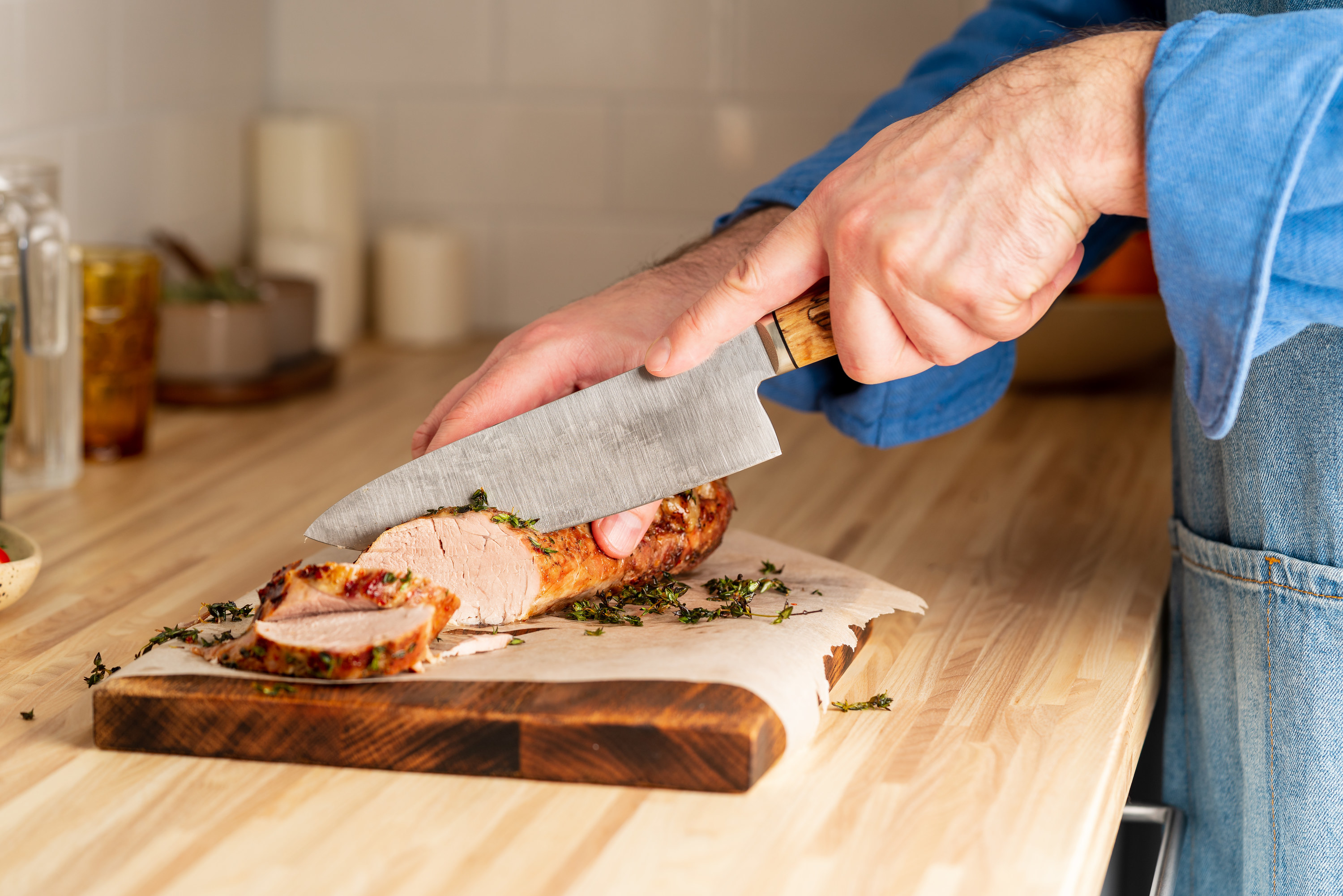 good meat being cut on a kitchen counter