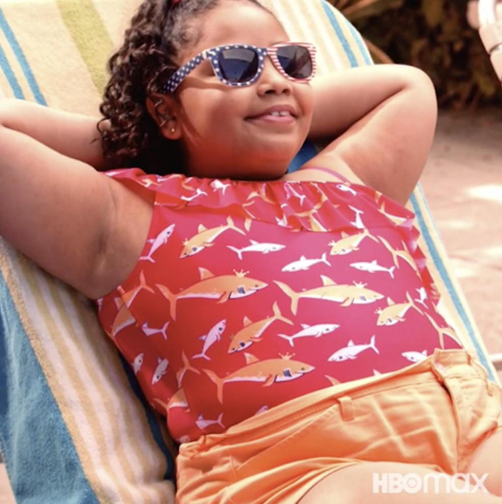 a young girl relaxing on a lounge chair