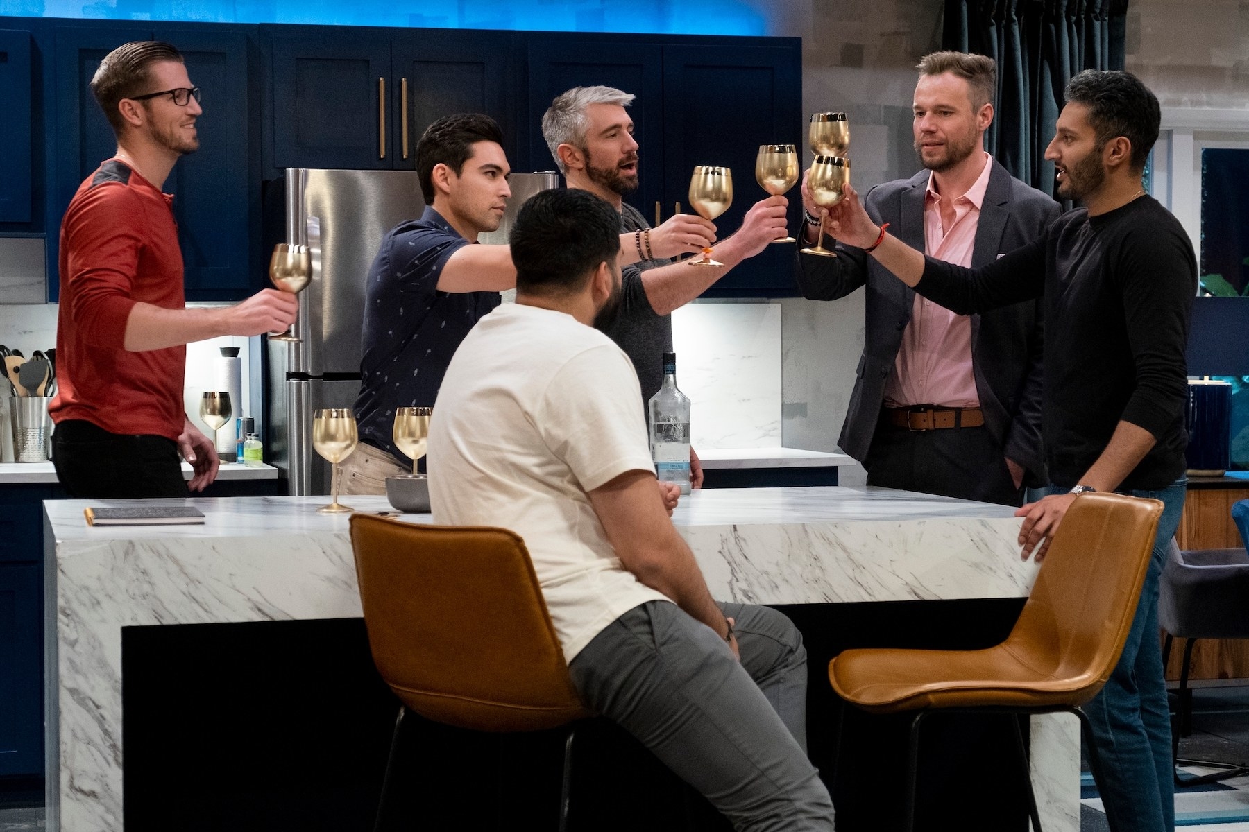 Male contestants of the show making a toast