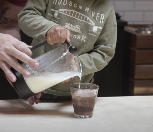 Frothing milk with a French press