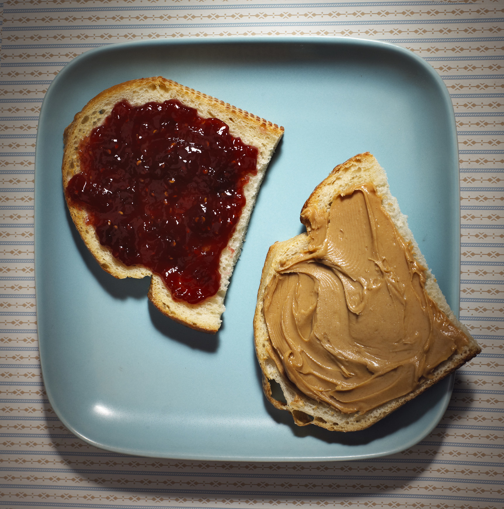 Assembling a peanut butter and jelly sandwich.