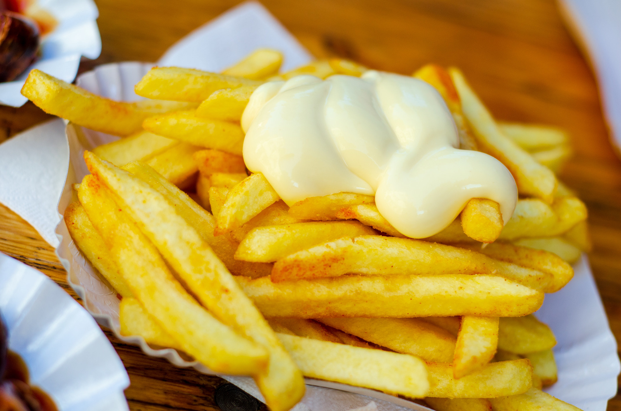 Close-up of french fries with mayo.