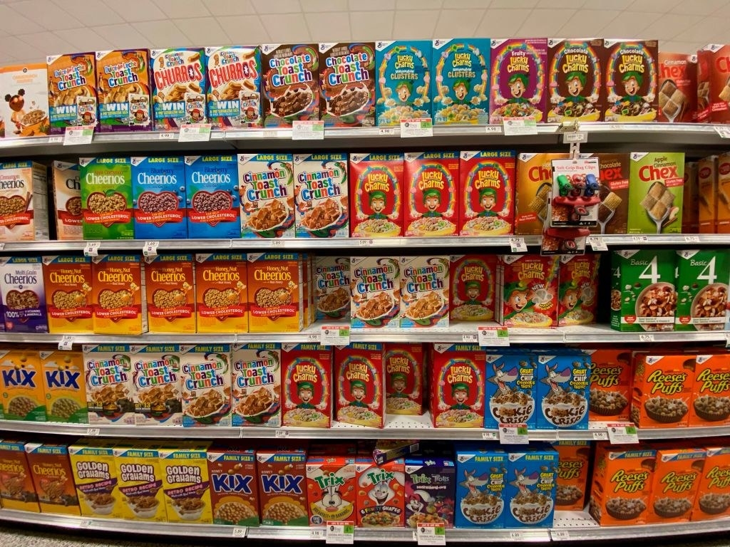 Different boxes of cereal at a grocery store.