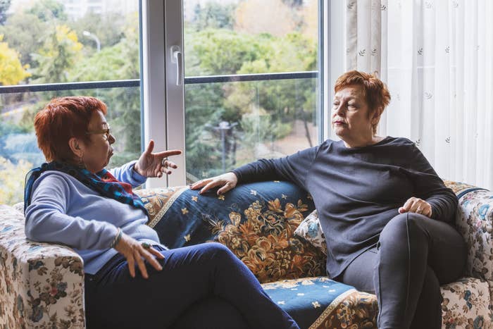 Two women talking on the couch