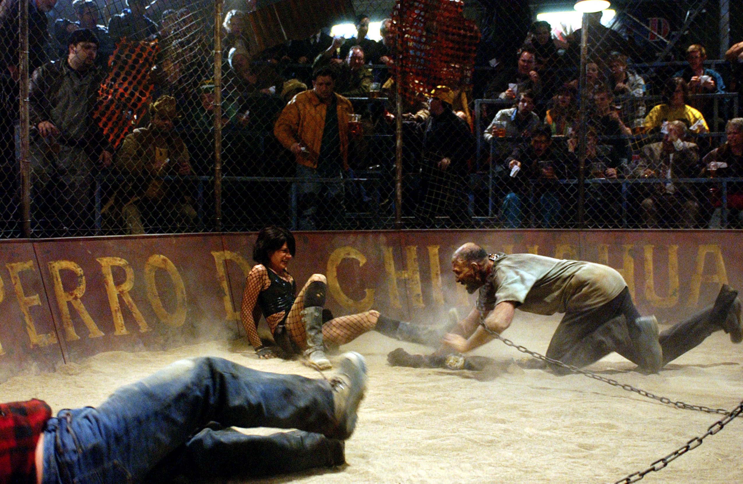 Crazed fans watch the visceral action in a zombie fight pit in &quot;Land of the Dead&quot;