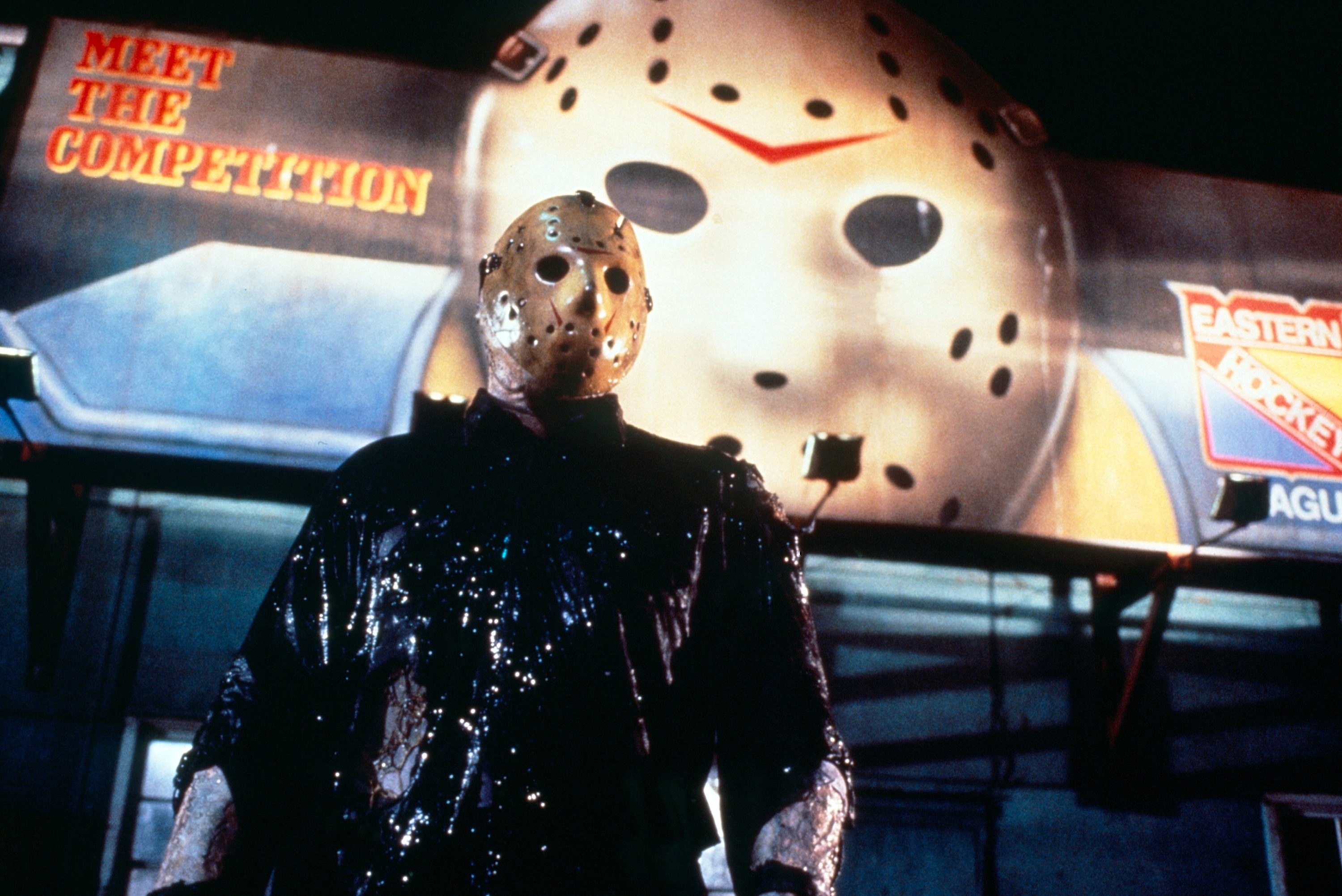Jason Voorhees stands in front of a hockey billboard in New York City in &quot;Friday the 13th, Part VIII: Jason Takes Manhattan&quot;