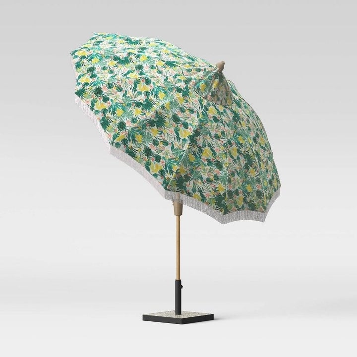 the tropical fringe umbrella tilted at an angle