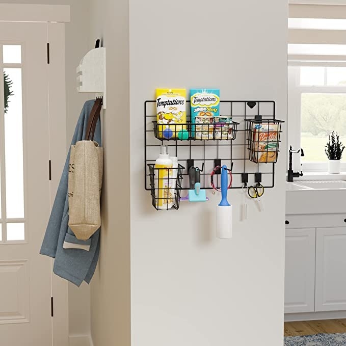 wall mounted storage basket showing with pet treats, lint roller, etc