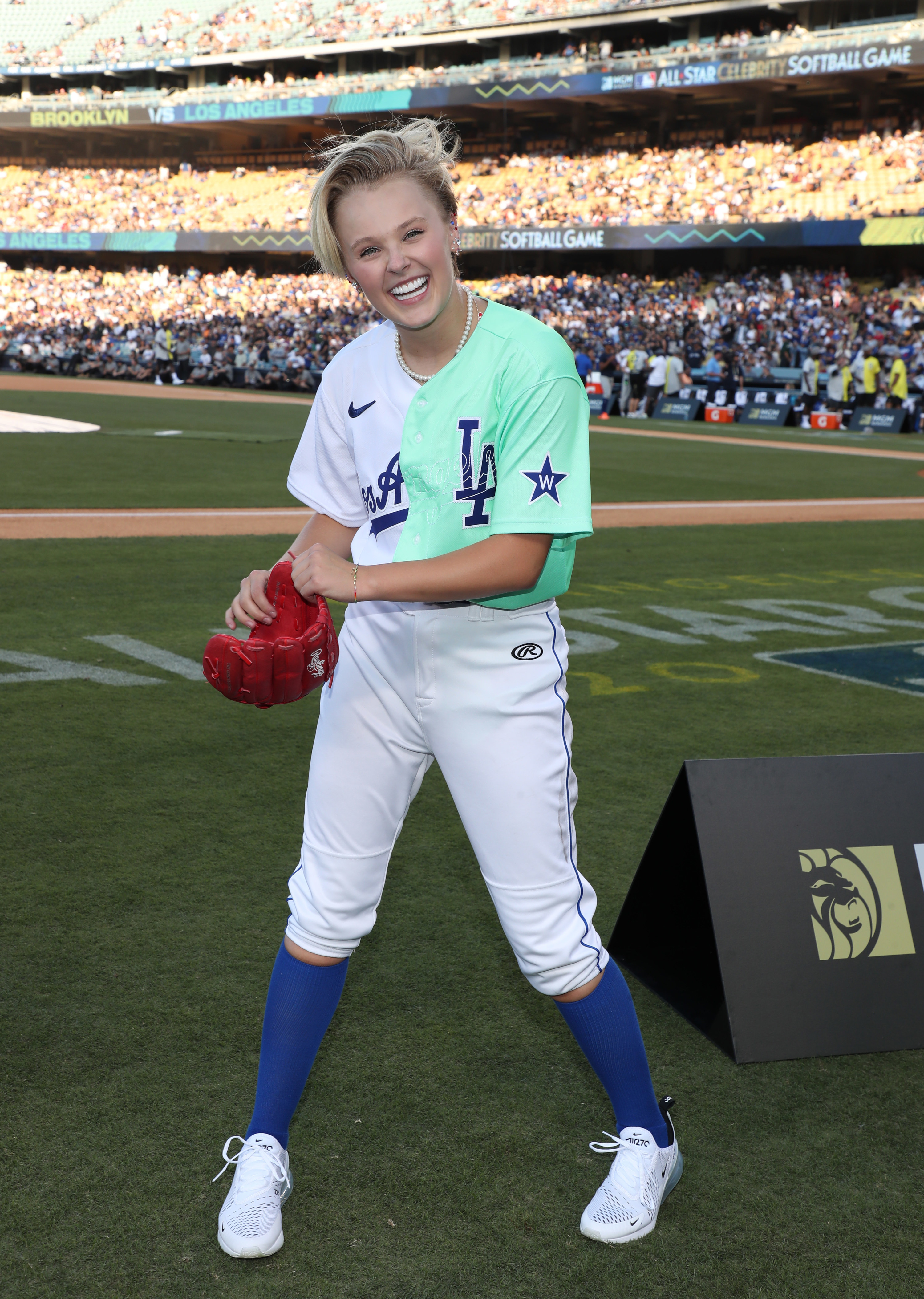 jojo wearing a baseball uniform on the field