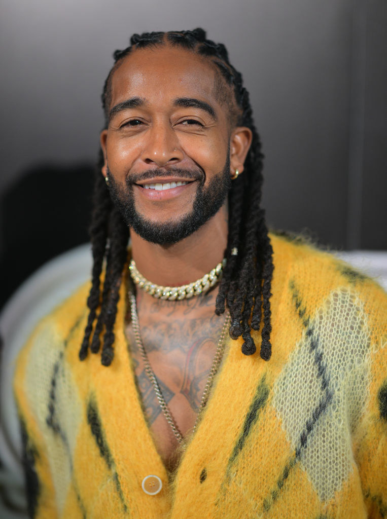 close up of omarion smiling with braids