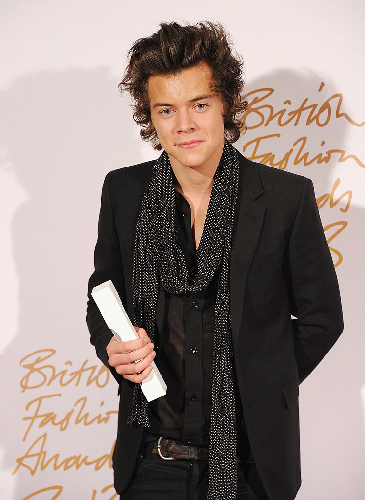 close up of harry in a blazer and scarf