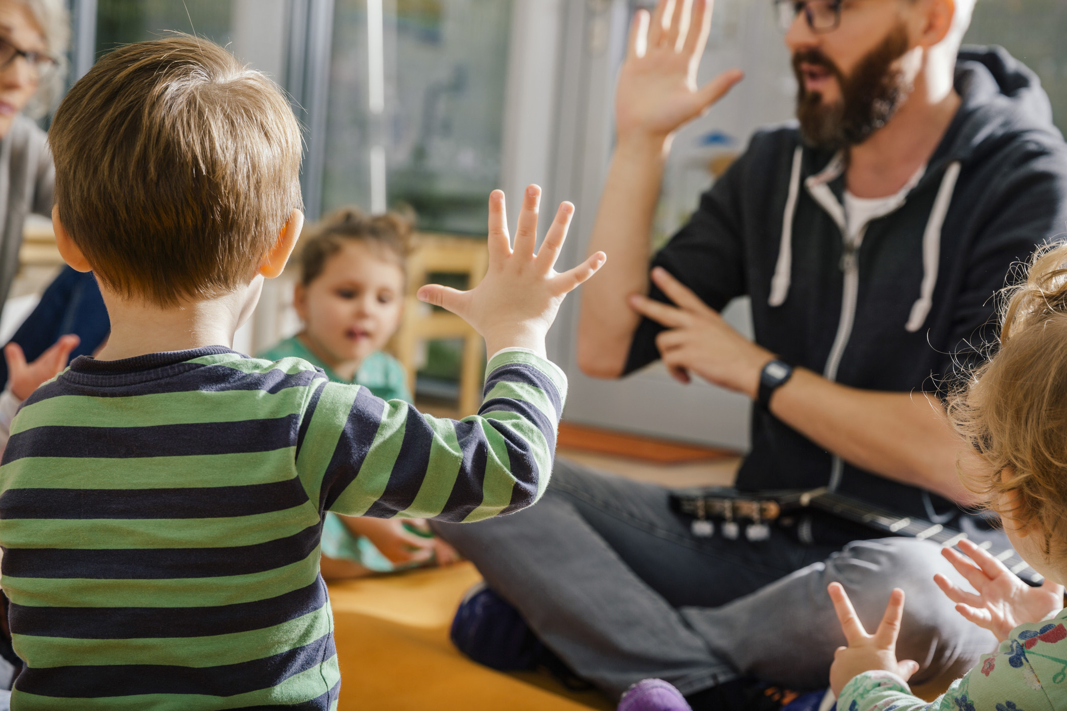 student with preschool kids