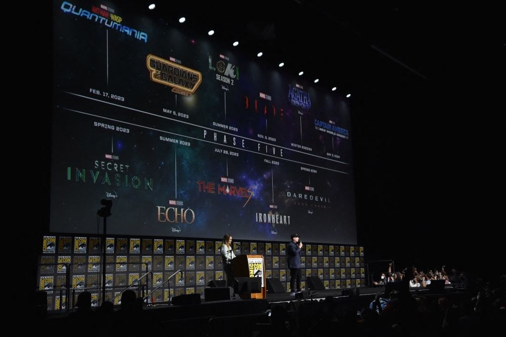 President of Marvel Studios Kevin Feige speaks during the Marvel panel in Hall H with a timeline labeled Phase Five on a huge screen behind him