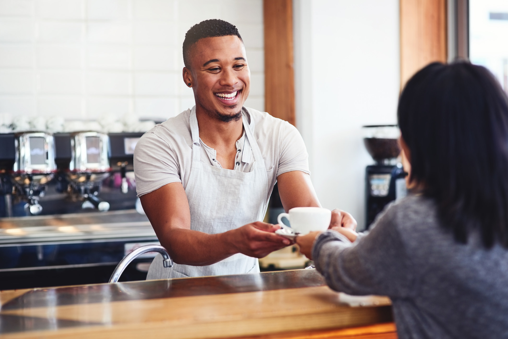 barista serving coffee