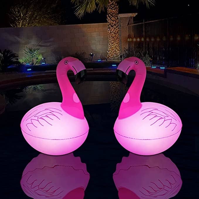 the flamingo lamps on a pool at night
