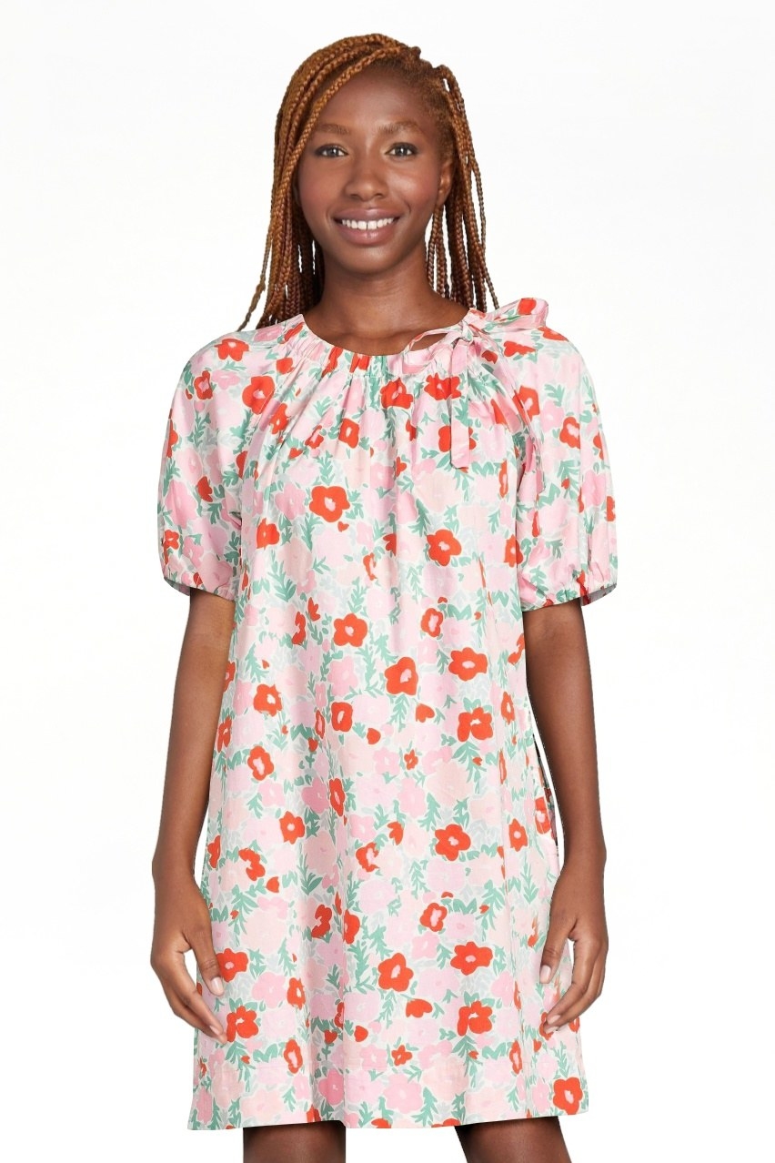 model wearing floral-print dress