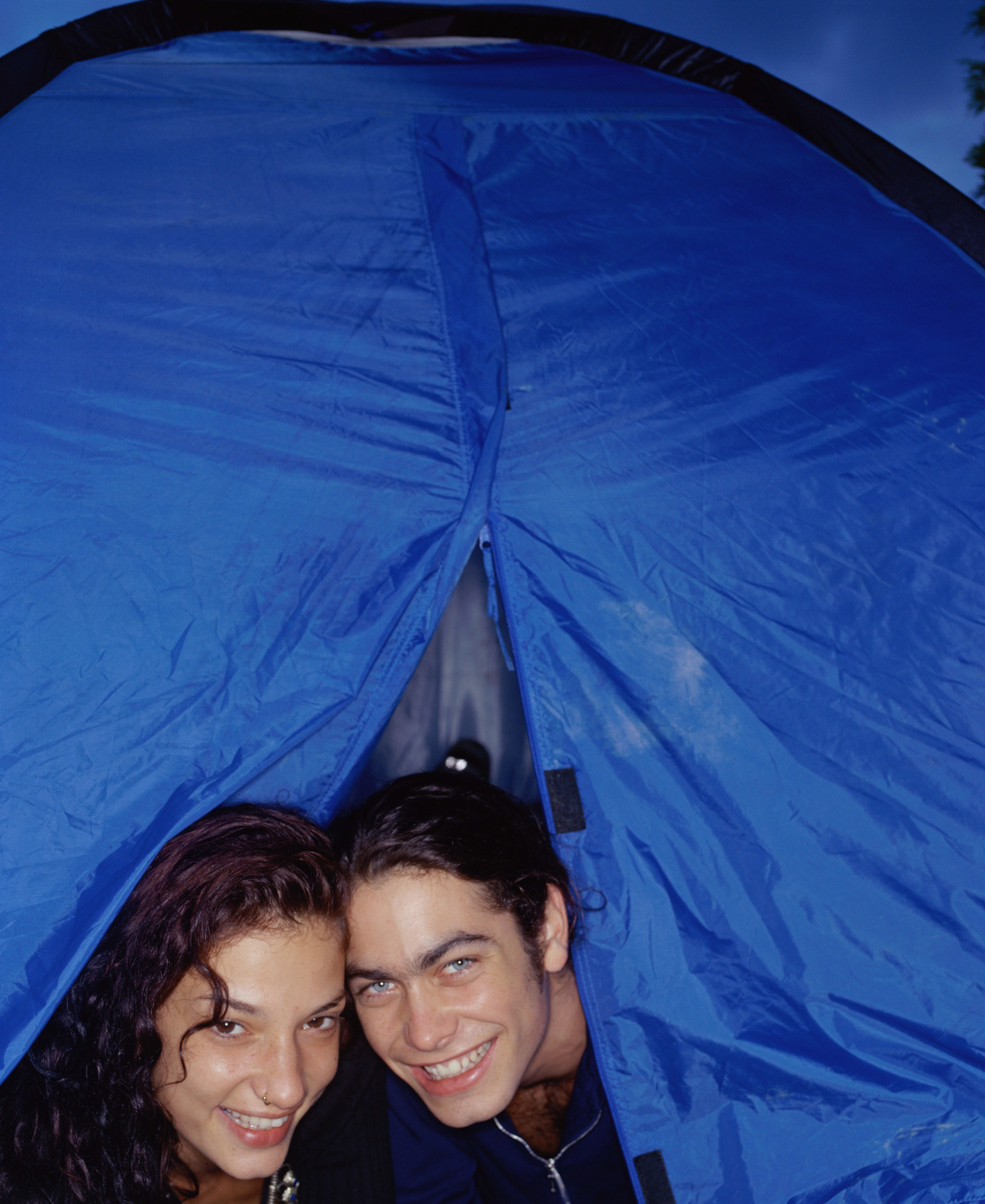two teens in a tent