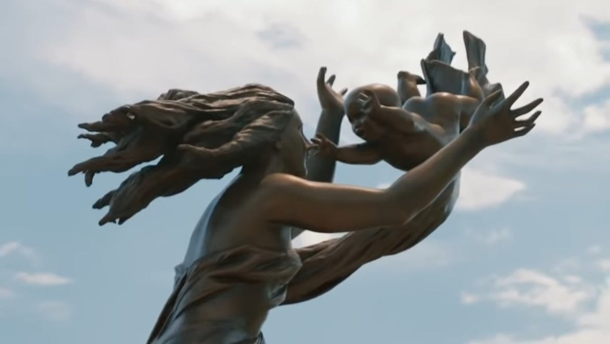 A statue of a woman reaching out to a baby in &quot;The Leftovers&quot;