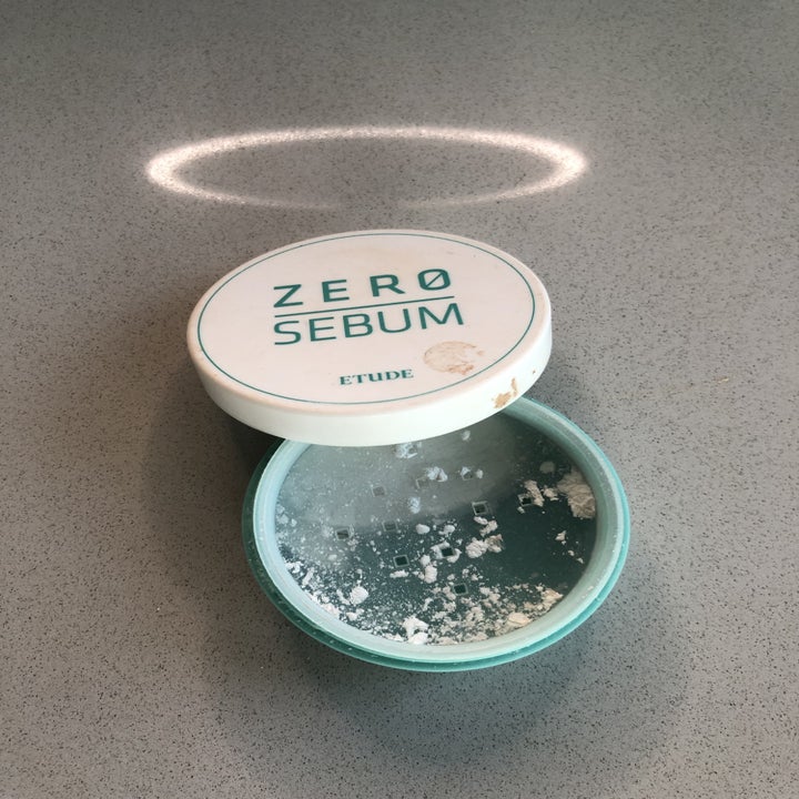 A reviewer's jar of white and blue powder