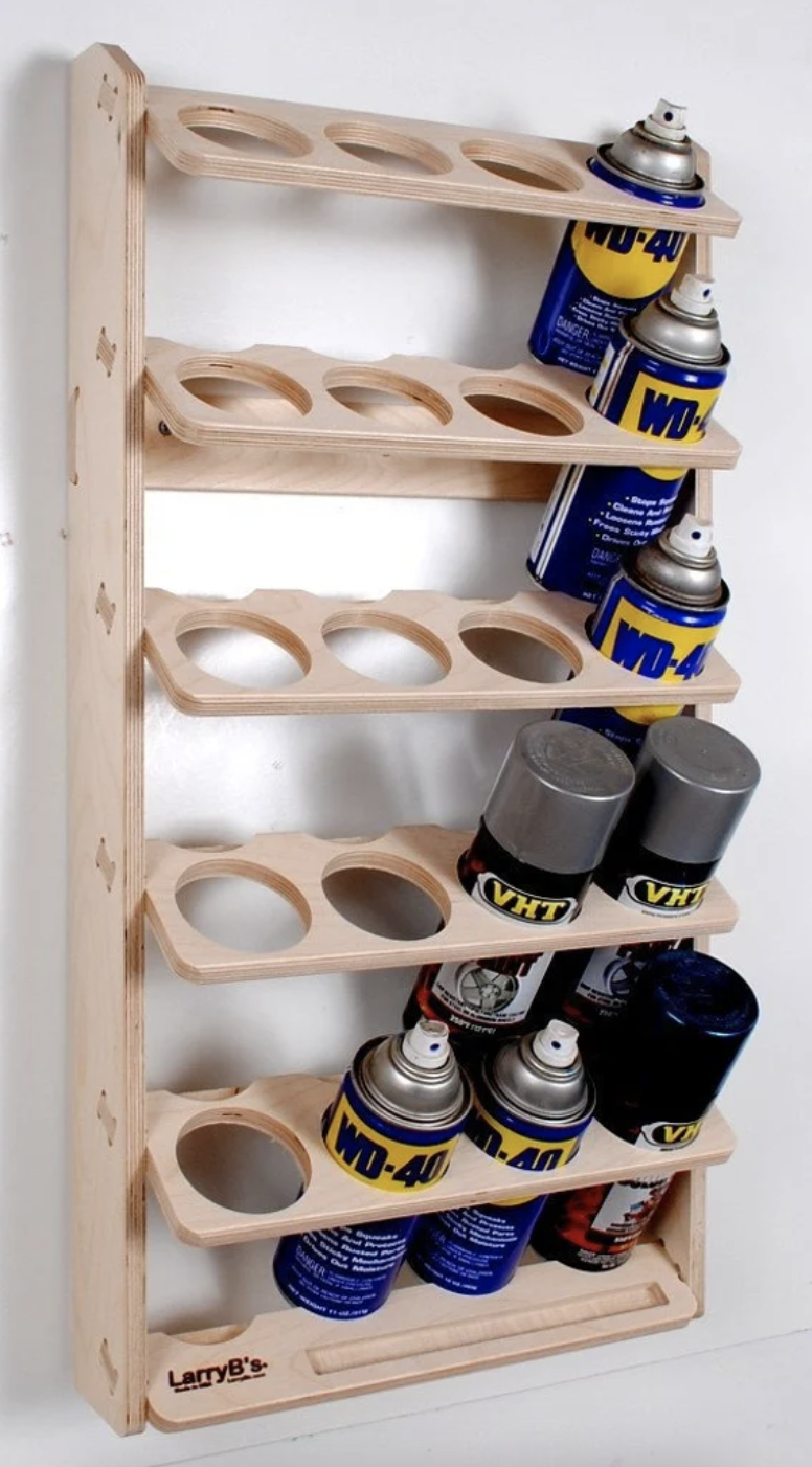 The storage rack is shown holding a few cans of WD-40
