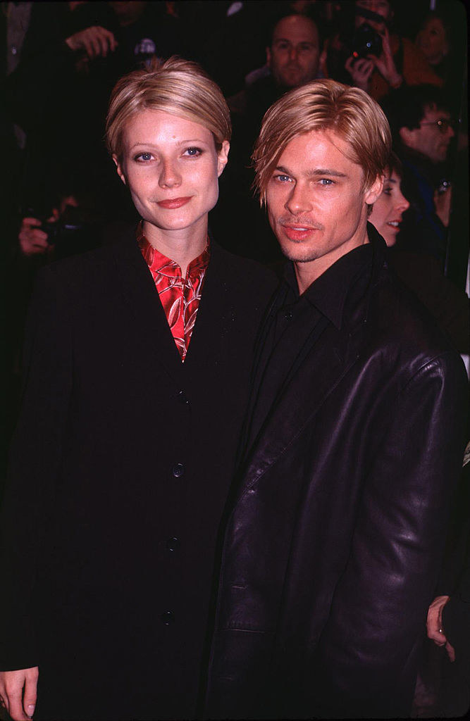 Gwyneth and Brad standing together and wearing dark clothing