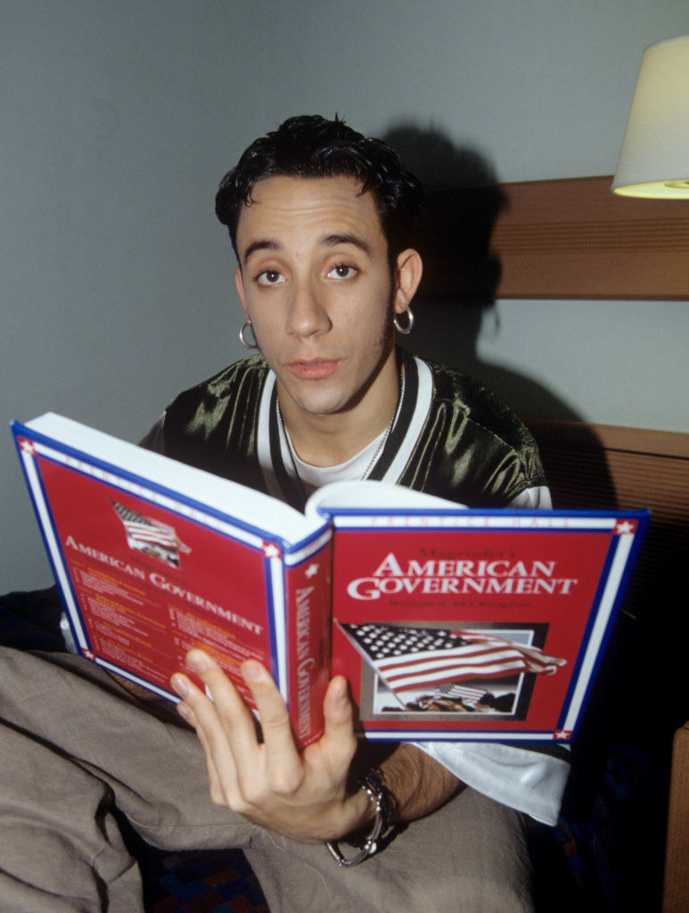 AJ holding an &quot;American Government&quot; textbook