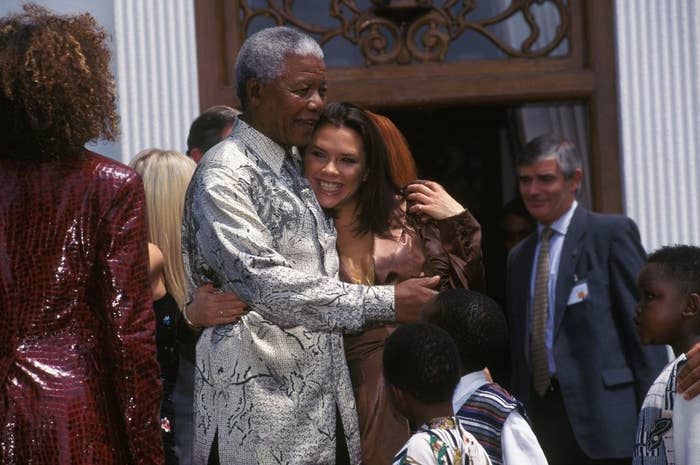 Nelson Mandela and Victoria Beckham hugging each other