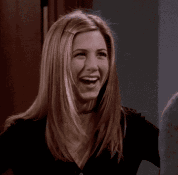 jennifer aniston as rachel on friends making a gesture indicating relief while sighing