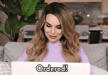 a gif of Rosanna Pansino looking at a laptop and saying &quot;ordered&quot;
